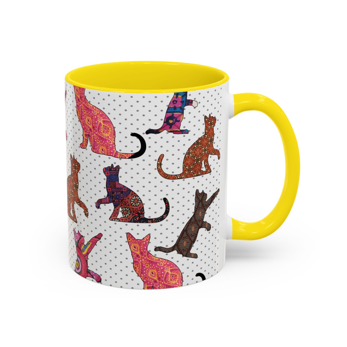 Yellow mug with colorful cat silhouette pattern.