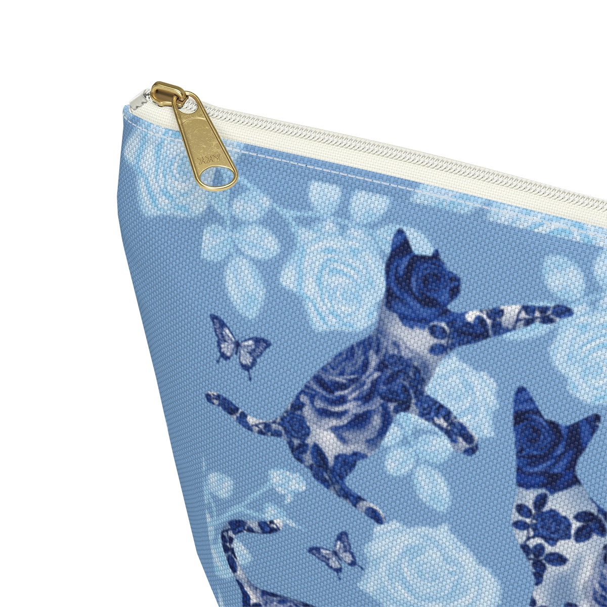 A floral blue accessory bag with a pattern of kitty silhouettes, roses, and butterflies, featuring a zipper closure. Cosmetic, makeup, toiletry, travel, pencil case & everyday essentials bag for cat lovers.