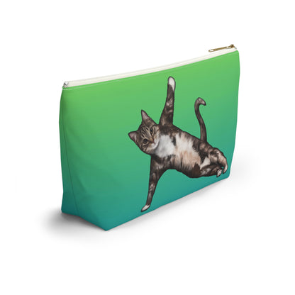 A green accessory bag featuring a printed image of a cat in a yoga pose. Cosmetic, makeup, toiletry, travel essentials, pencil case & everyday bag for cat lovers.