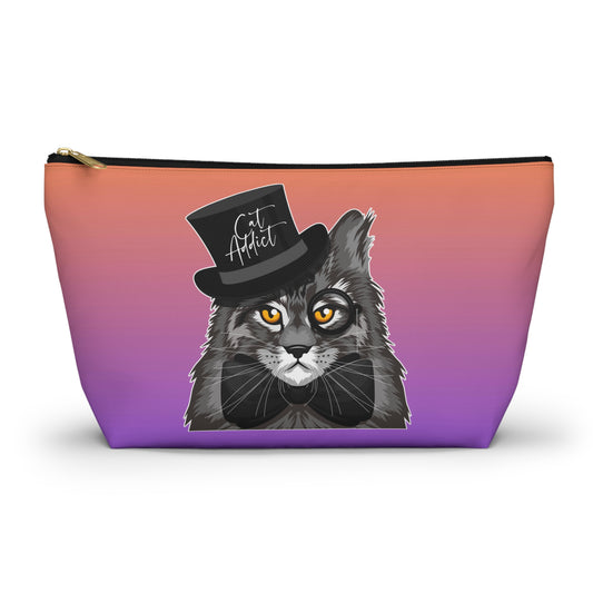 A purple & orange colored accessory bag with zip for Maine Coon cat lovers. Use for cosmetics, makeup, toiletries, travel essentials. Design features a Maine Coon cat wearing a top hat & the words "Cat Addict". 