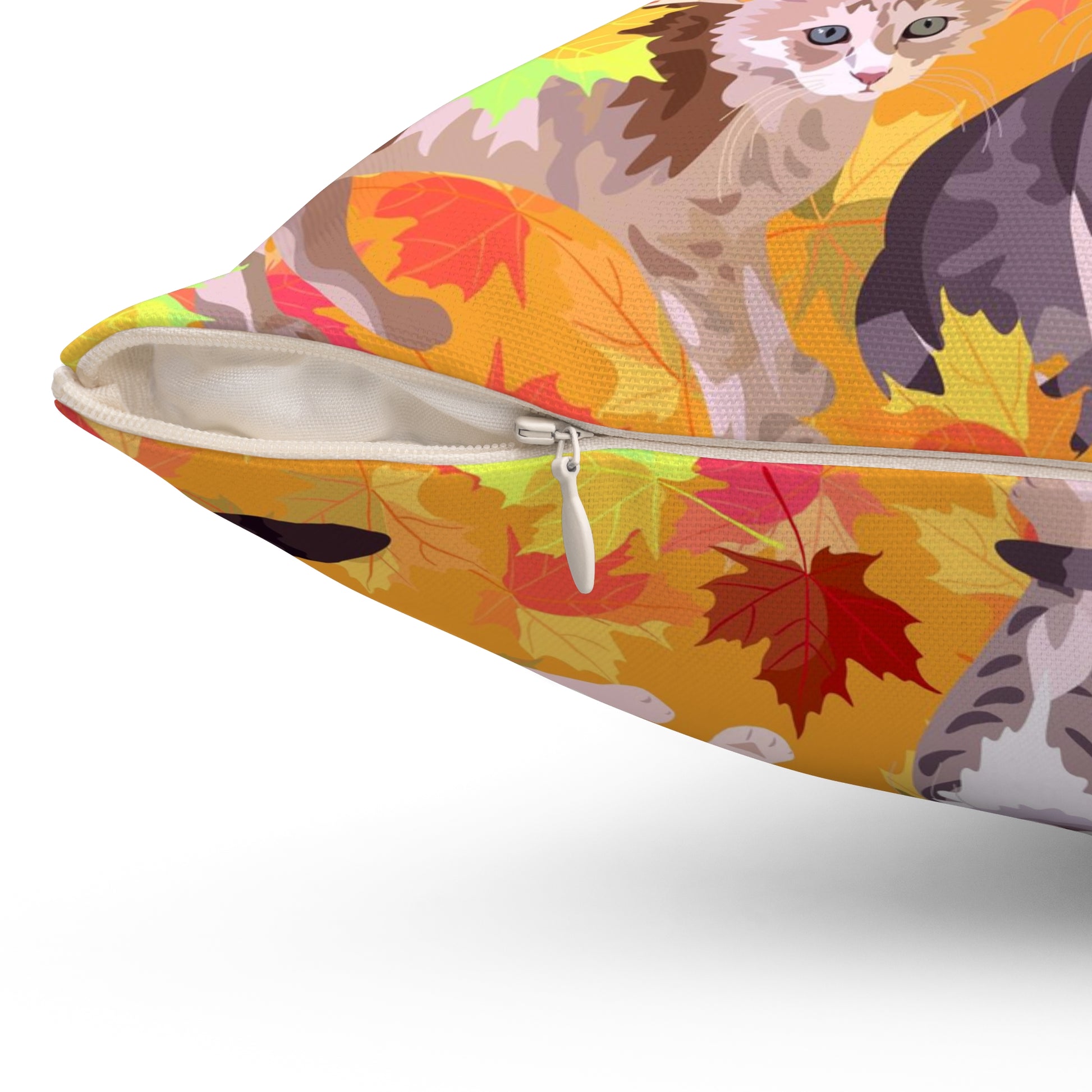 A square-shaped throw pillow with a fall leaves pattern, featuring various cartoon cats among the leaves.