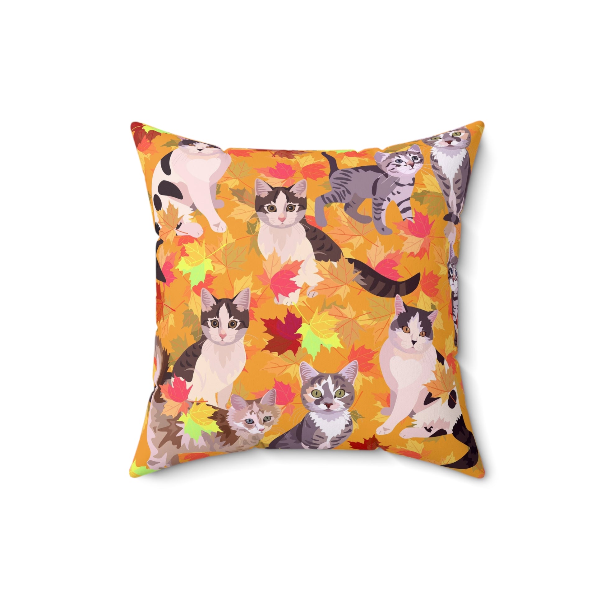 A square-shaped throw pillow with a fall leaves pattern, featuring various cartoon cats among the leaves.