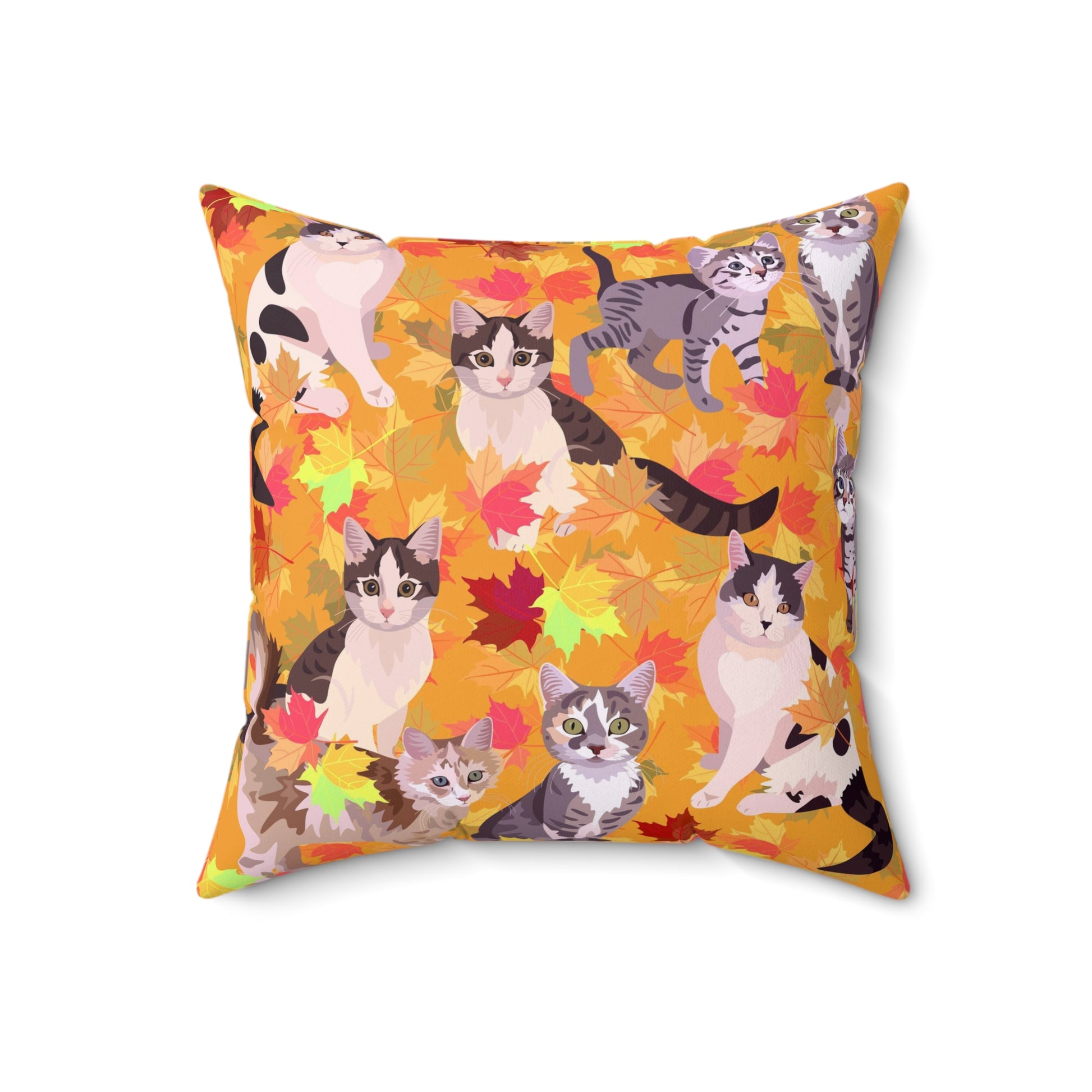 A square-shaped throw pillow with a fall leaves pattern, featuring various cartoon cats among the leaves.