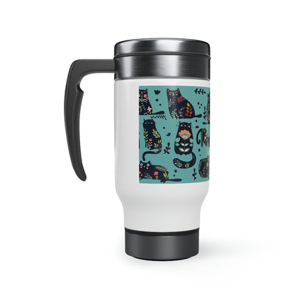 A stainless steel travel mug with a colorful cats-and-flowers design and a black handle. 