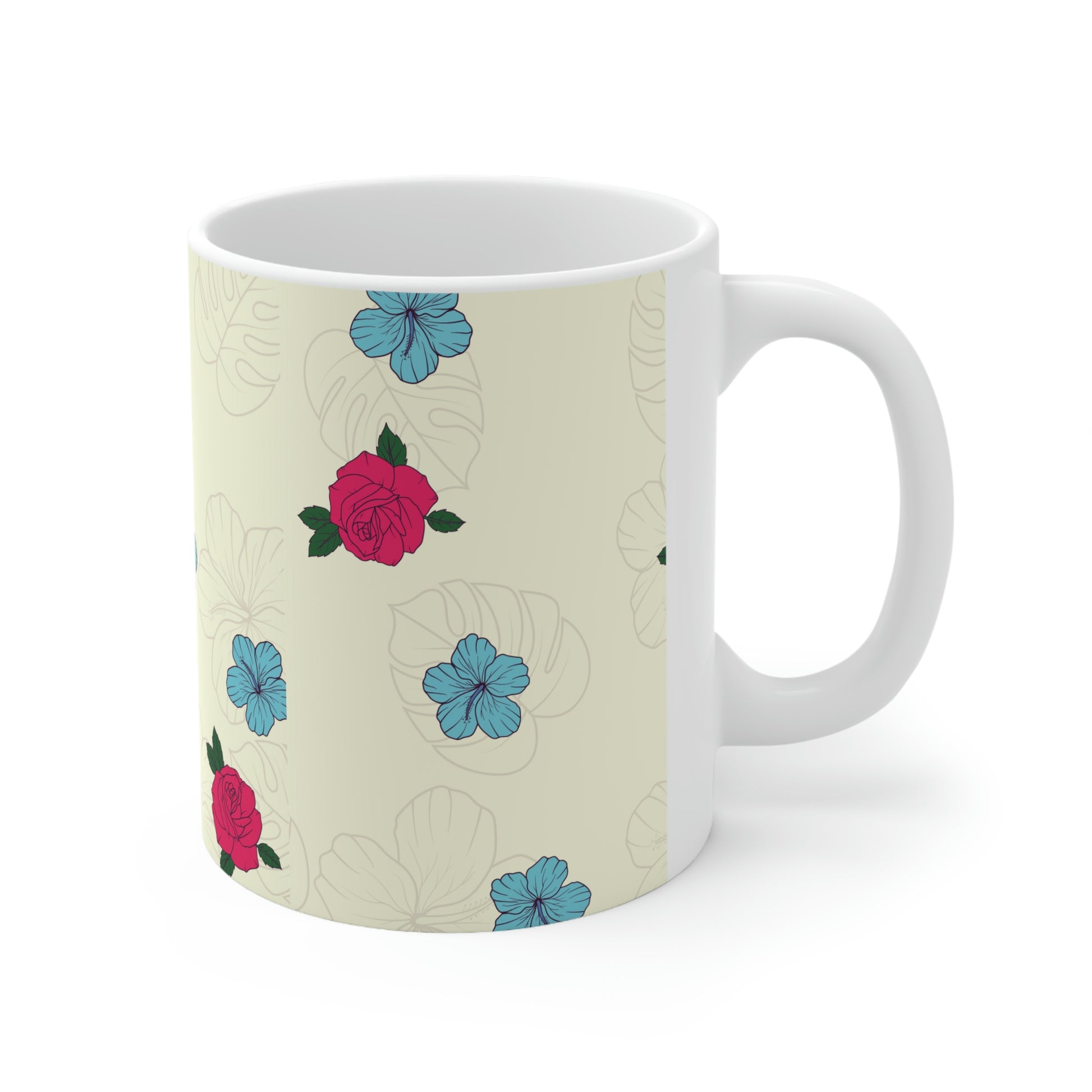 Cream mug of a cartoon Bengal cat drinking from a cup against a floral background