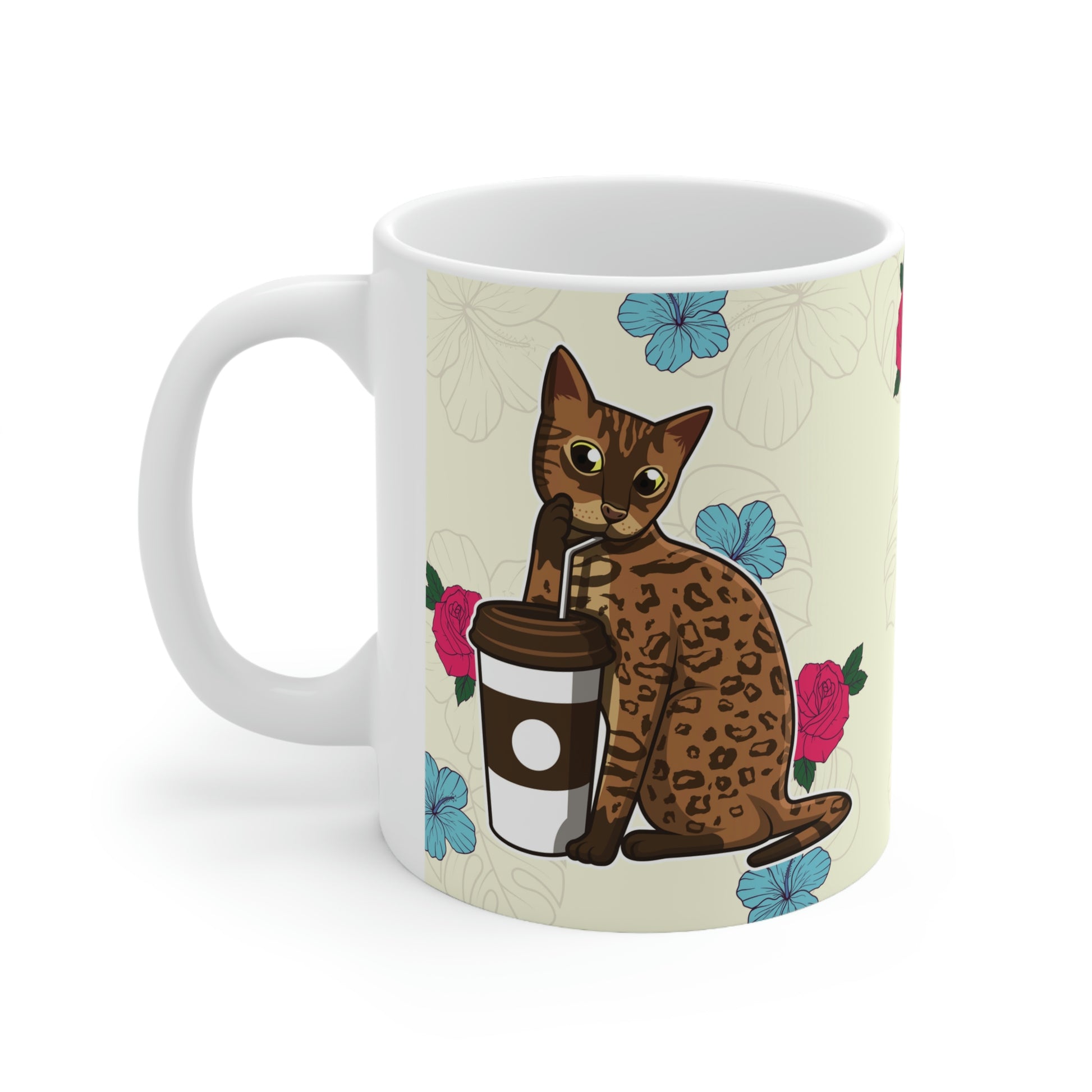 Cream mug of a cartoon Bengal cat drinking from a cup against a floral background