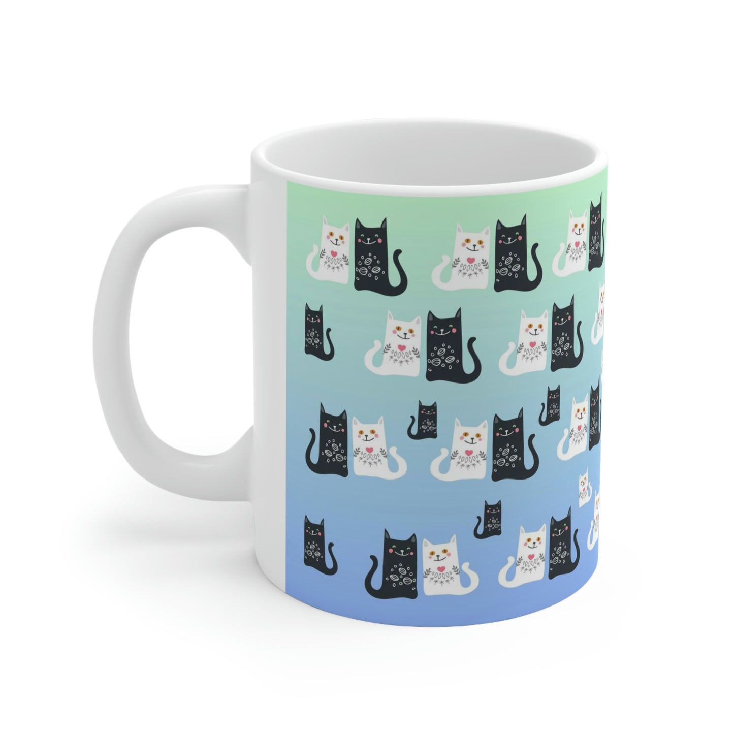 Mug with a pattern of black and white cartoon cats.
